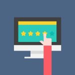 Business owner responding to Google reviews on a laptop