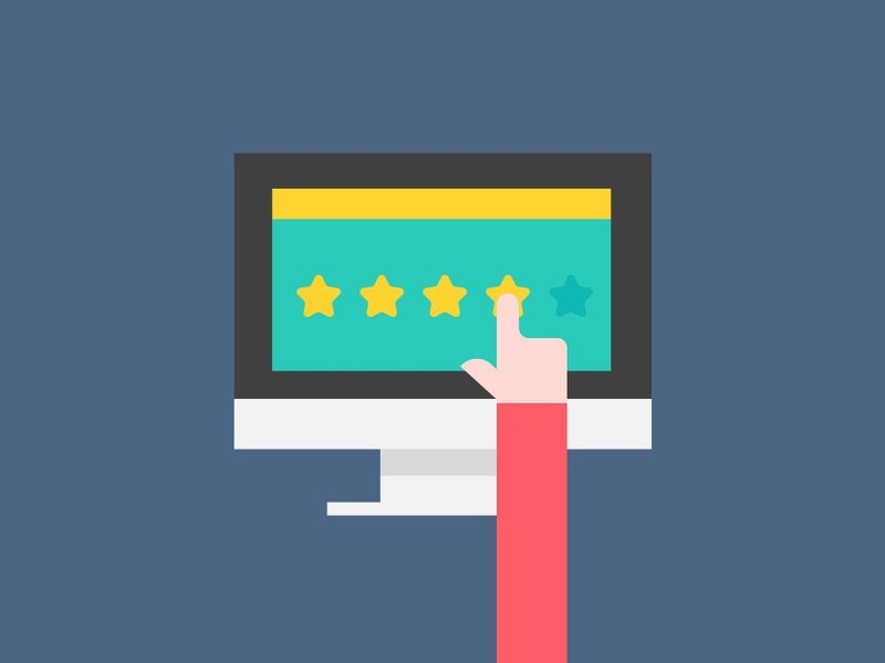 Business owner responding to Google reviews on a laptop